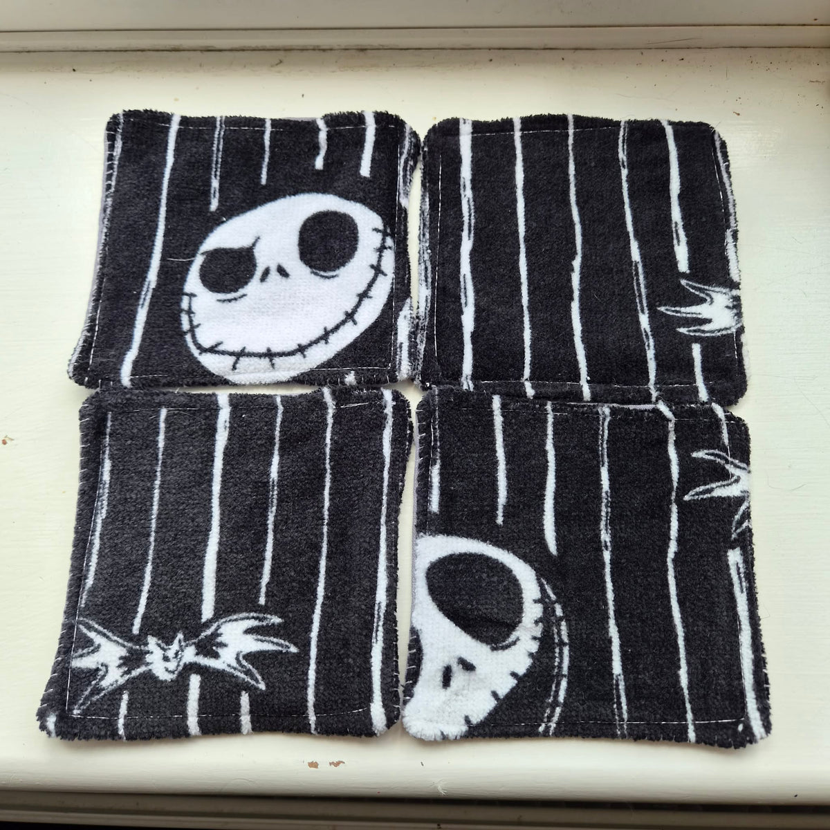 Handmade reusable Jack Skeleton face scrubbies